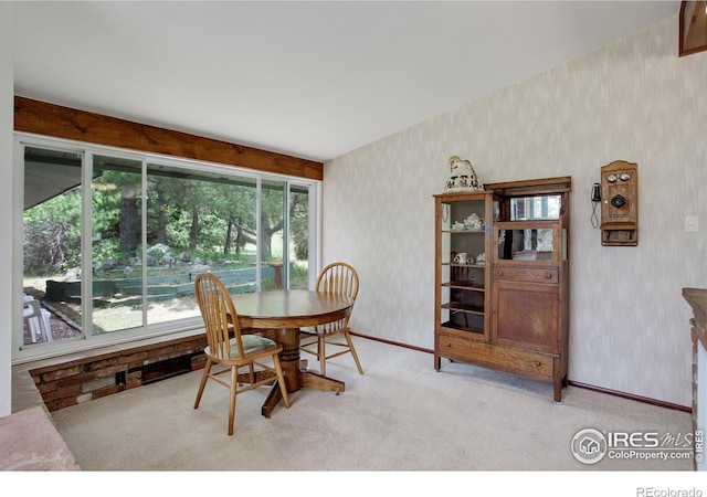 dining room featuring light carpet