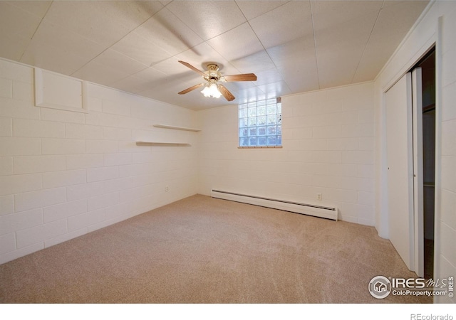 interior space featuring ceiling fan, carpet floors, and a baseboard heating unit