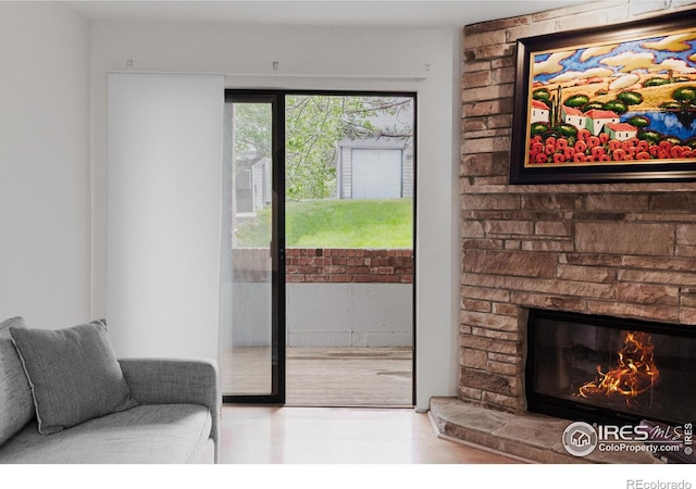 entryway featuring a stone fireplace