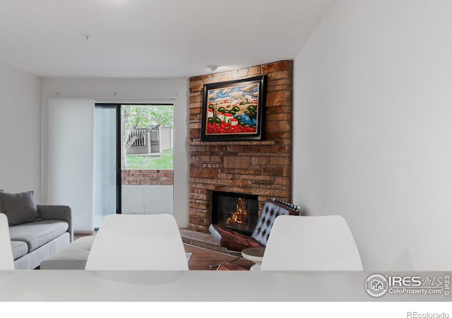 living room with a stone fireplace