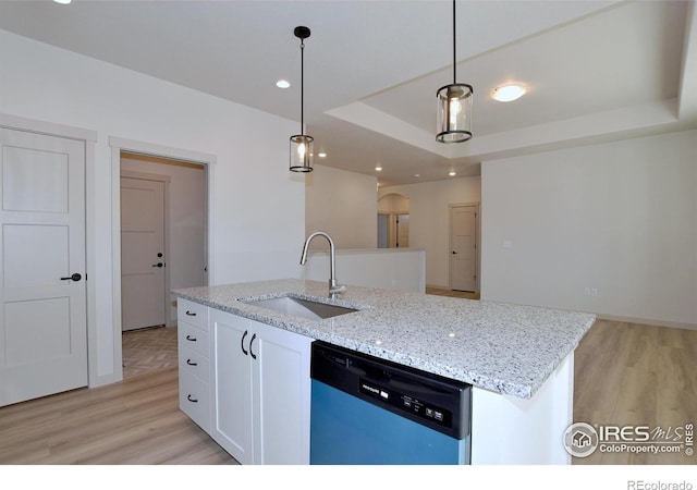 kitchen with dishwasher, sink, white cabinetry, and pendant lighting