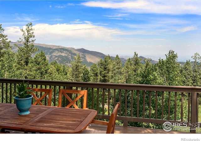 wooden terrace featuring a mountain view