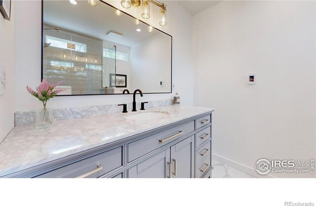 bathroom with vanity and an enclosed shower