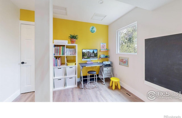 home office with light wood-type flooring