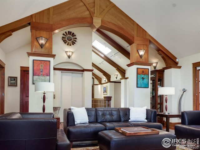 living room with lofted ceiling with beams