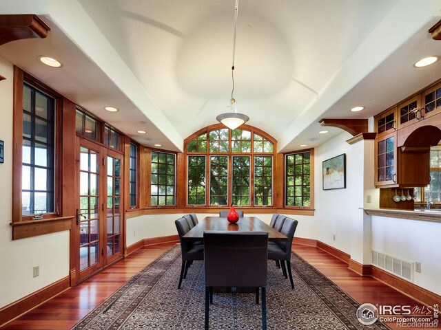 dining room featuring dark hardwood / wood-style floors and french doors