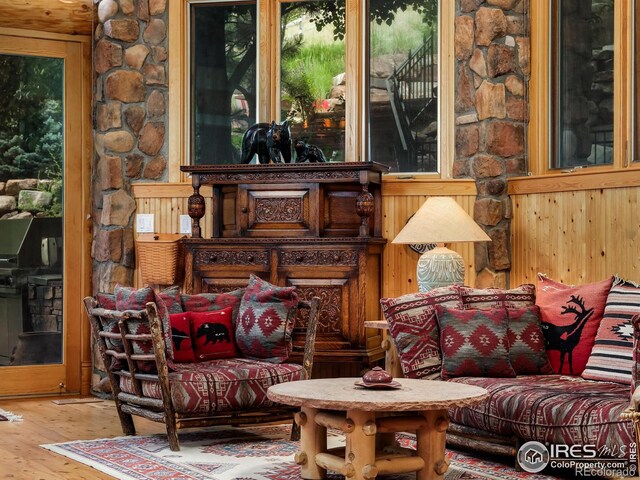 sitting room with wood-type flooring
