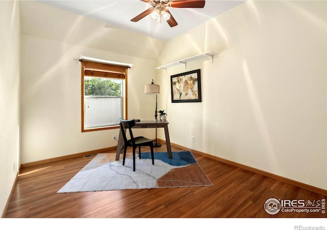 office space featuring vaulted ceiling, hardwood / wood-style floors, and ceiling fan