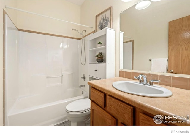 full bathroom featuring shower / bathtub combination, vanity, and toilet