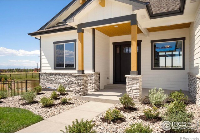 entrance to property with covered porch