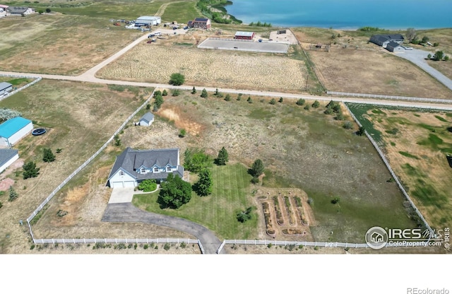 birds eye view of property featuring a rural view