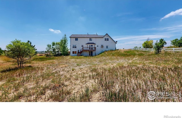 back of property with a rural view