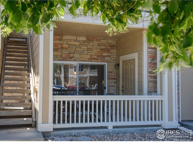 doorway to property with covered porch