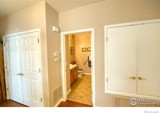 hallway featuring a textured ceiling