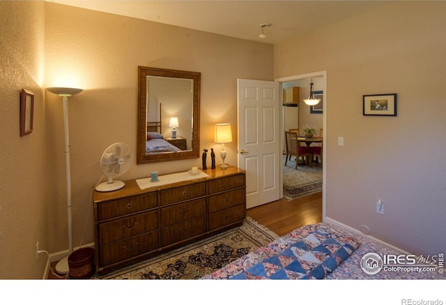 bedroom featuring dark hardwood / wood-style floors