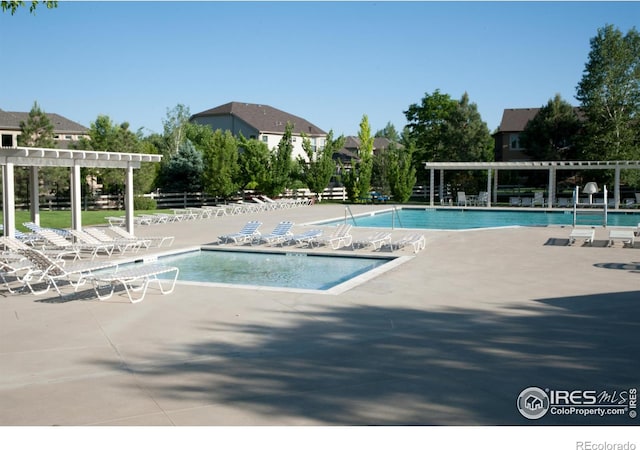 view of pool with a patio area and a pergola