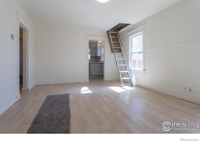 unfurnished living room with light wood-type flooring