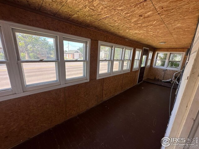 unfurnished sunroom with plenty of natural light