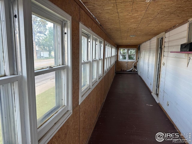 unfurnished sunroom with wood ceiling