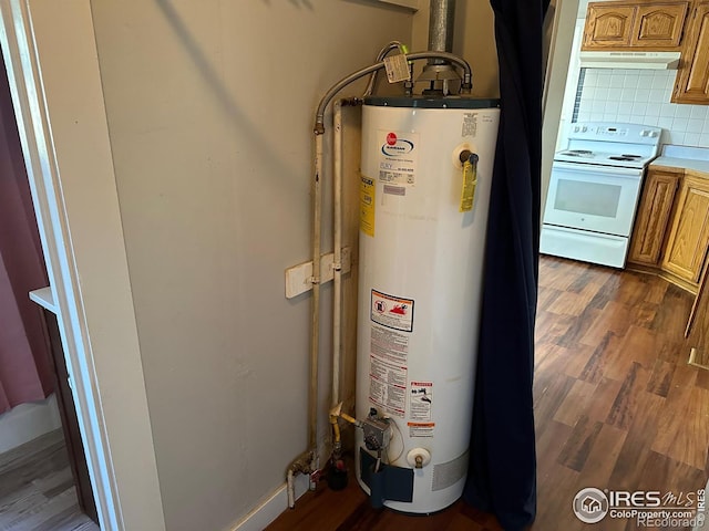 utility room featuring water heater