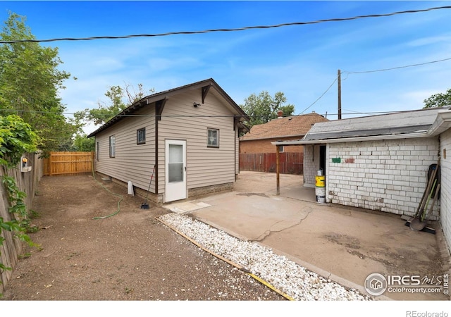 rear view of property with a patio area