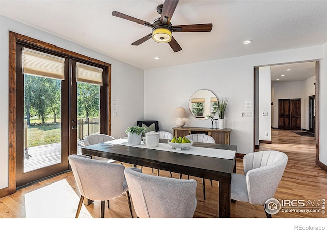 dining space featuring ceiling fan and light hardwood / wood-style floors