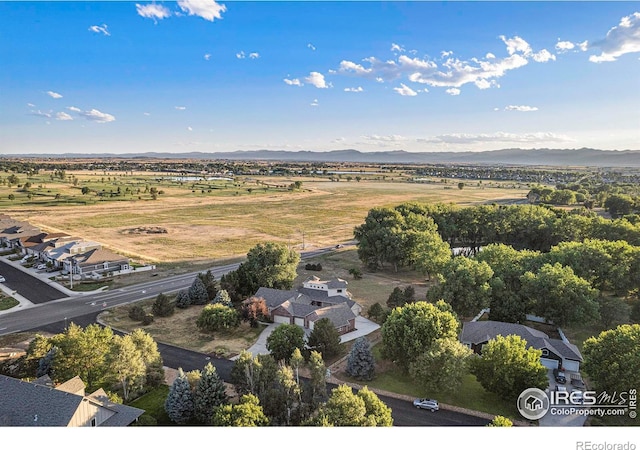 birds eye view of property featuring a mountain view