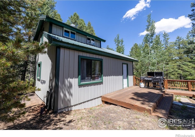 exterior space featuring a wooden deck