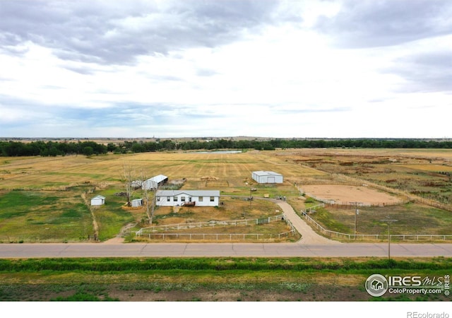 birds eye view of property featuring a rural view