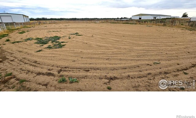 view of yard with a rural view