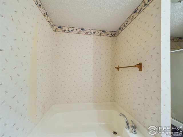 bathroom with a textured ceiling