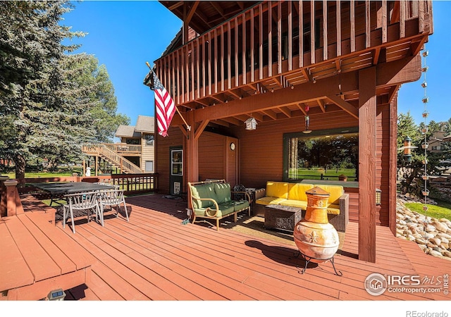 deck with an outdoor hangout area