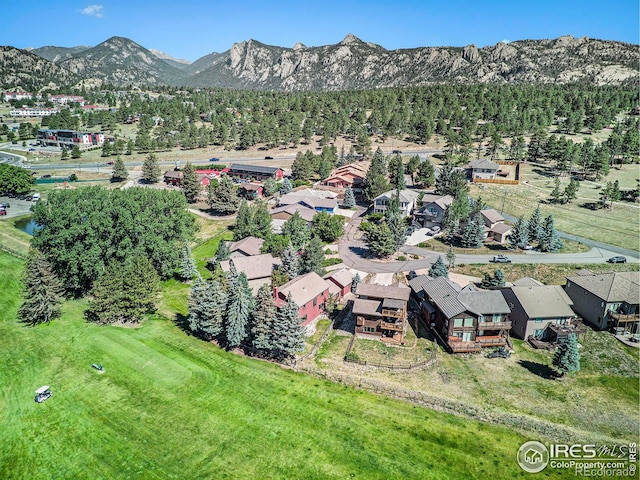 birds eye view of property with a mountain view