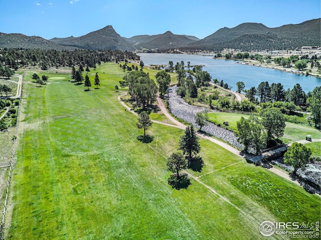 aerial view featuring a water and mountain view