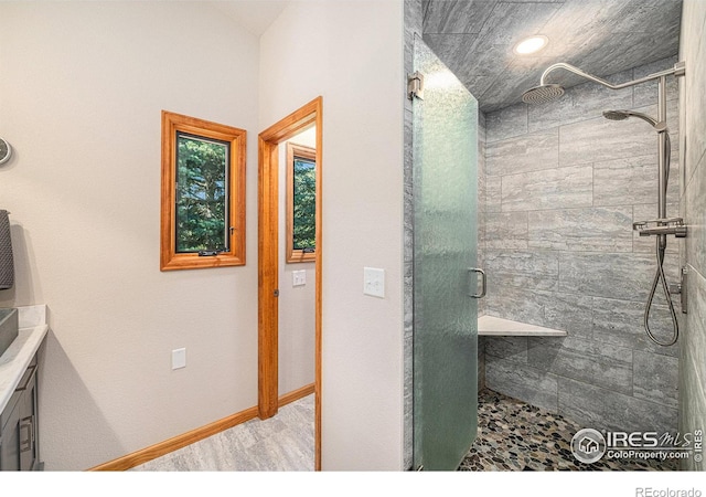 bathroom with a shower with shower door