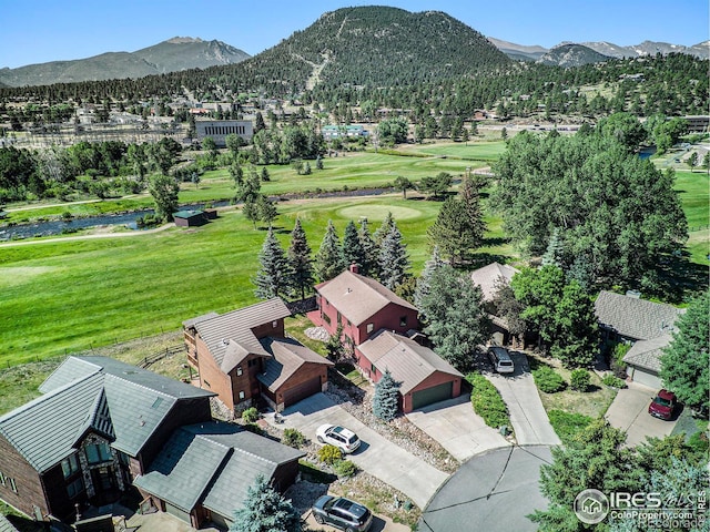 birds eye view of property featuring a mountain view