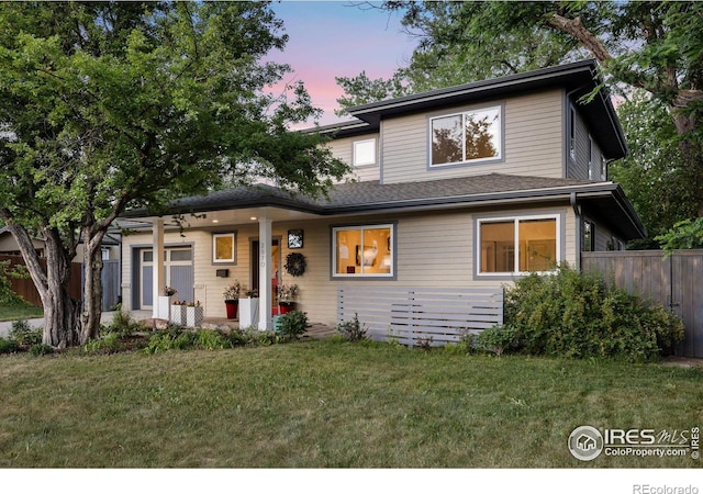 view of front of house with a yard