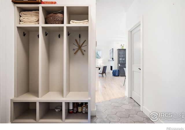 mudroom featuring light tile patterned floors