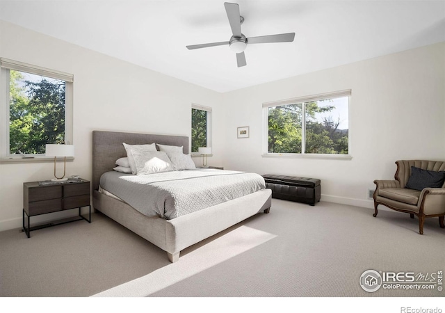 carpeted bedroom with ceiling fan