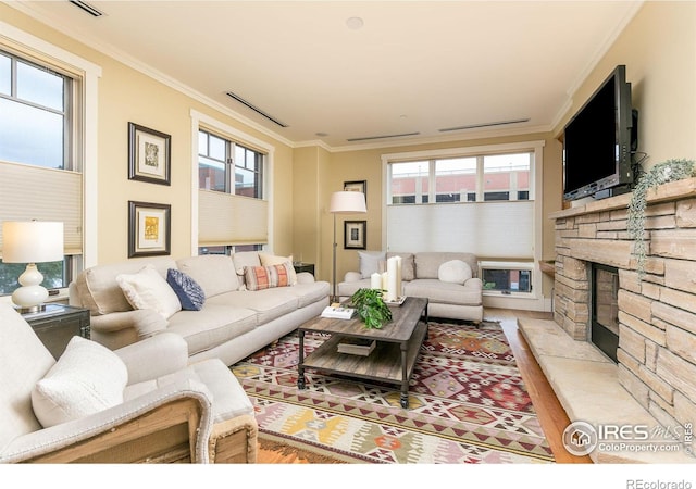 living room with a wealth of natural light and ornamental molding