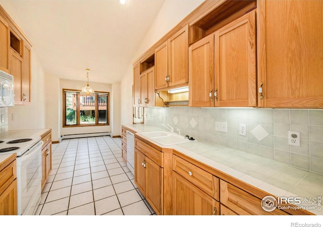 kitchen with tasteful backsplash, white appliances, sink, decorative light fixtures, and tile countertops