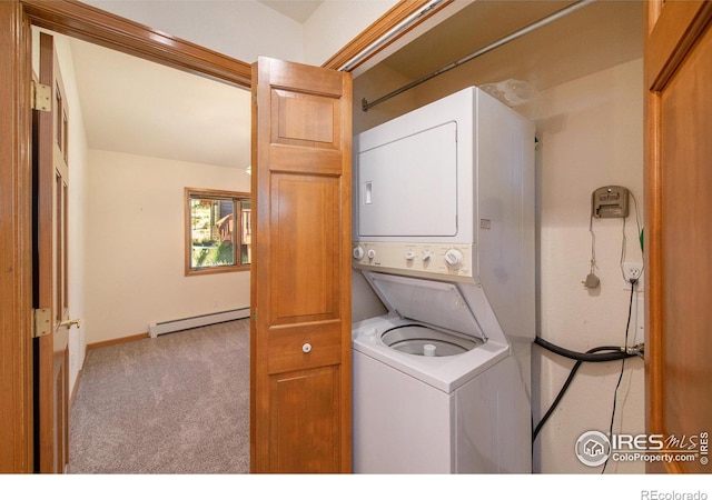 clothes washing area featuring stacked washer and dryer, light colored carpet, and a baseboard heating unit