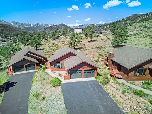 drone / aerial view featuring a mountain view