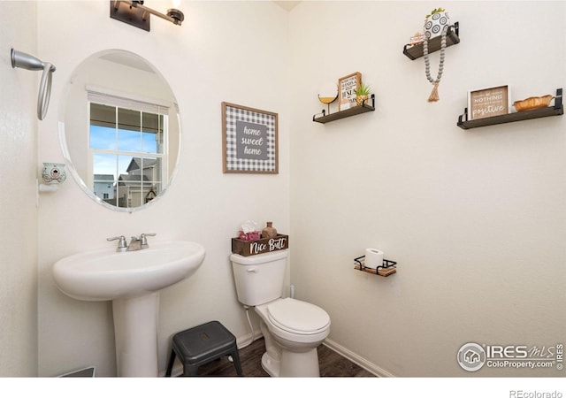 bathroom featuring sink and toilet