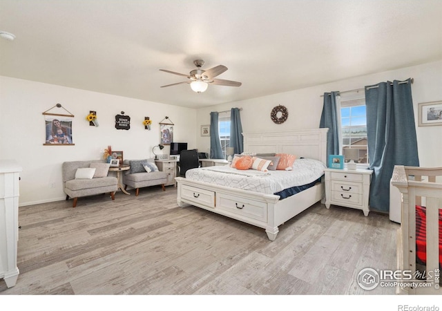 bedroom featuring light wood-type flooring and ceiling fan