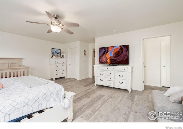 bedroom with ceiling fan and light hardwood / wood-style flooring