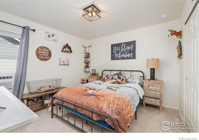 bedroom with light colored carpet and a closet