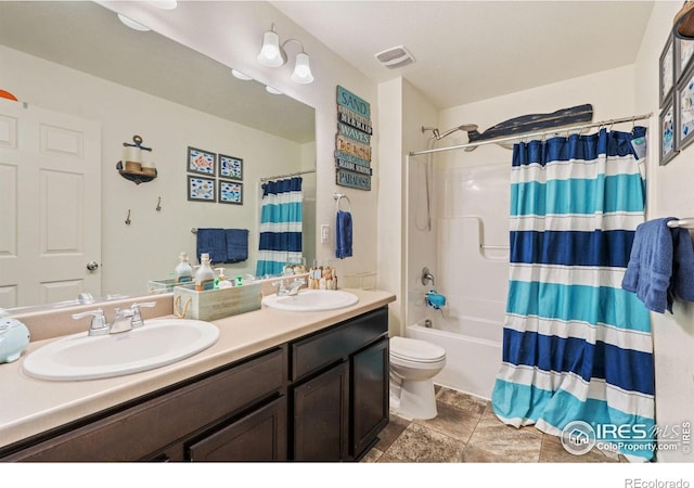 full bathroom featuring vanity, toilet, and shower / tub combo