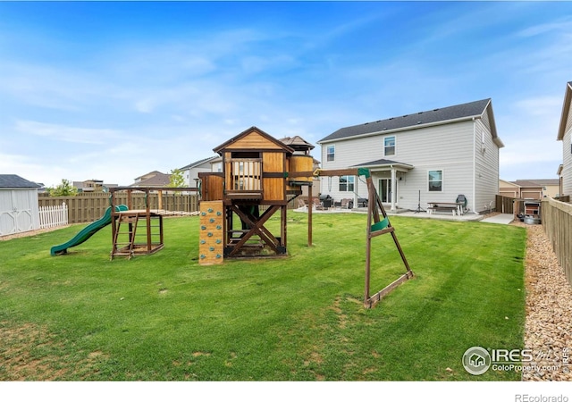 view of jungle gym with a lawn