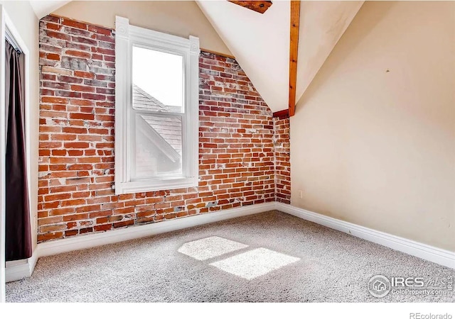 additional living space featuring carpet floors and lofted ceiling